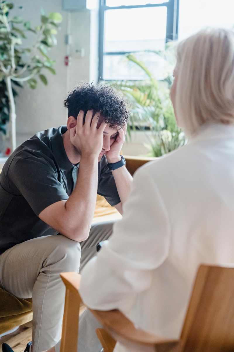 A Man Sitting with a Therapist